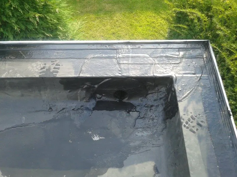 Renovatie plat dak garage te Melle: nieuwe EPDM-dakbedekking, foto 1