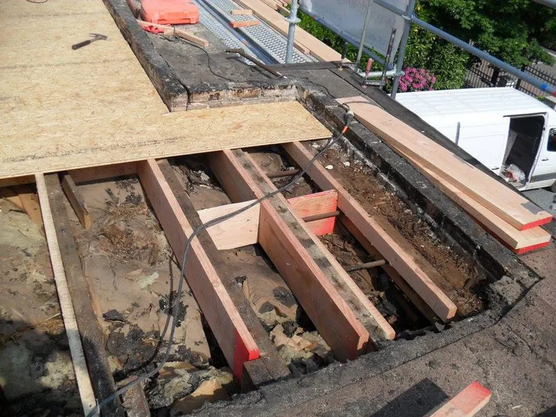 Renovatie plat dak te Lochristi: nieuwe OSB-dakplaten